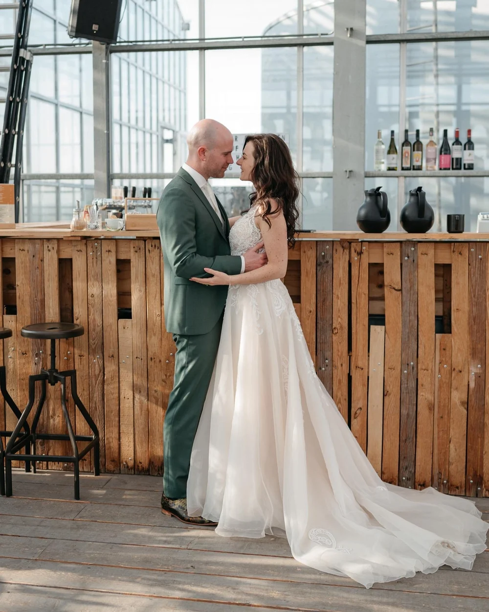 Couple getting married in Haarlem, they are holding and looking at each other with love.