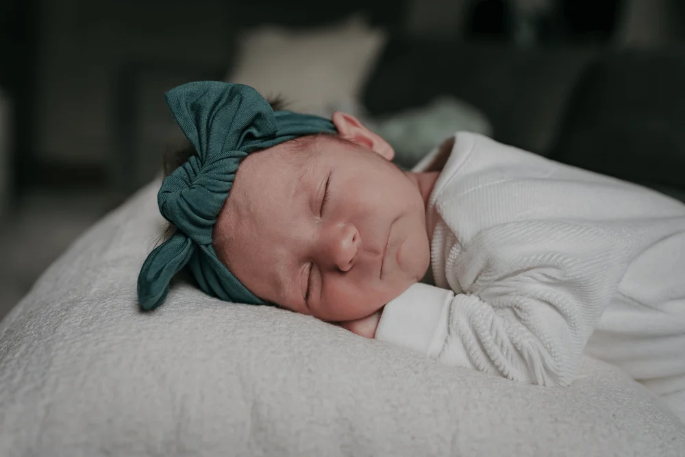Newborn baby lying on a pillow in a home in Amsterdam