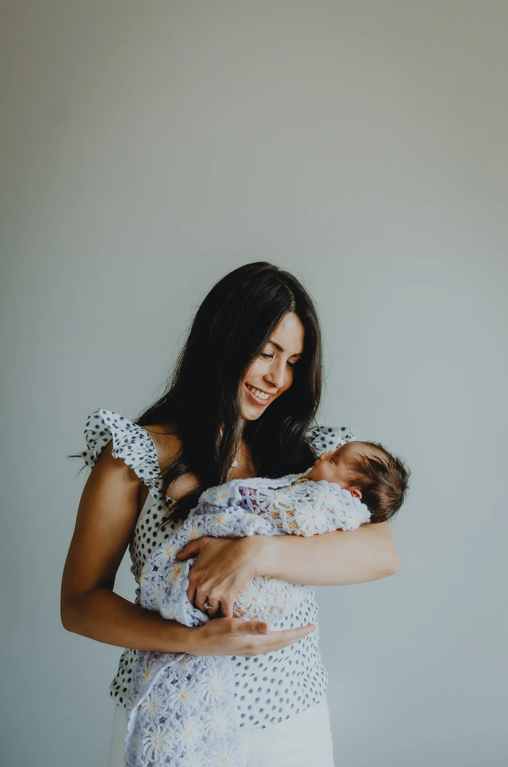 Mom holding her newborn baby