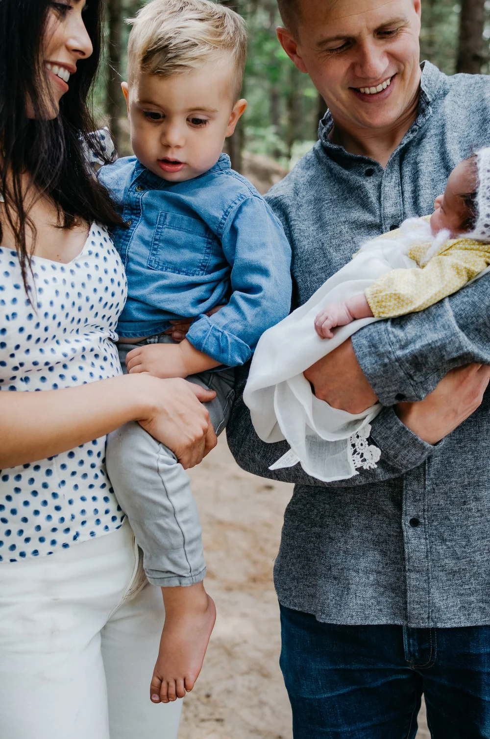 Closeup of mom, dad, brother and newborn baby girl