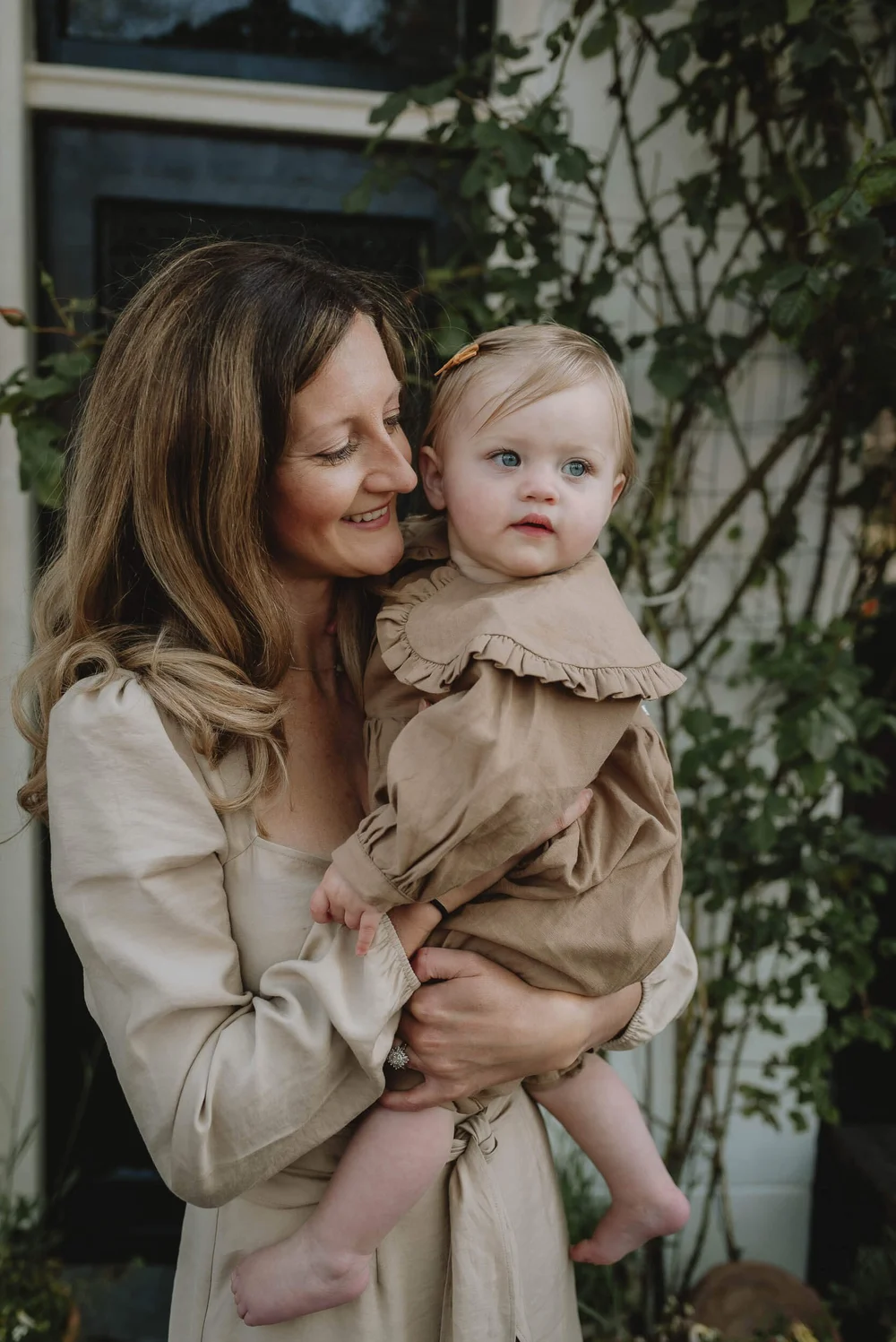 Mother holding an looking at her daugher