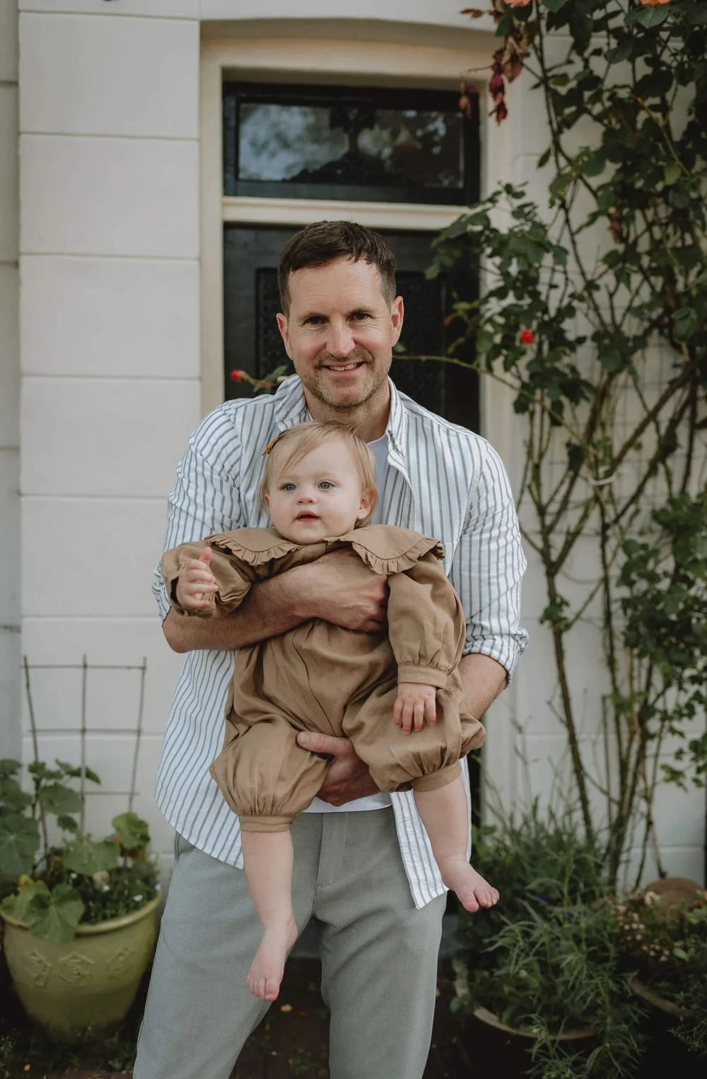 Father holding his daughter