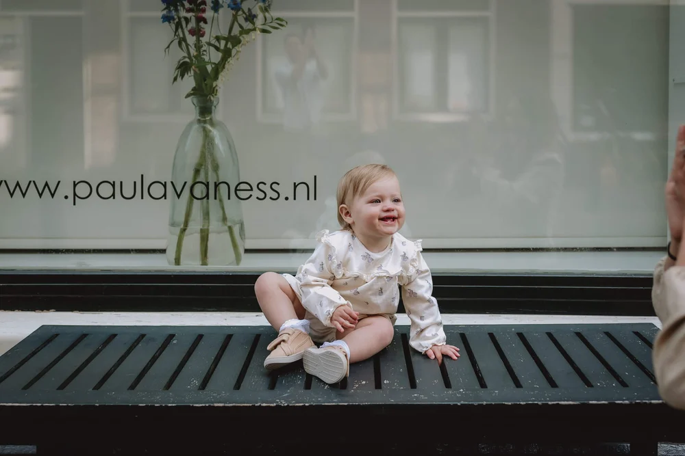 Baby on a bench, Amsterdam, the Netherlands
