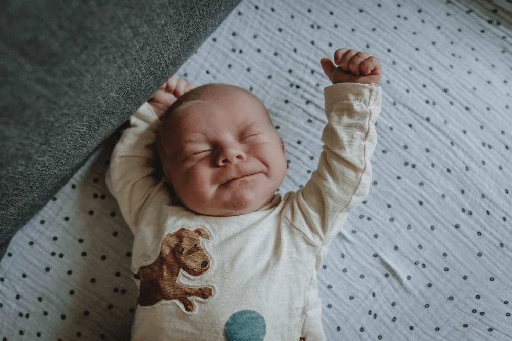 Newborn baby having a stretch.
